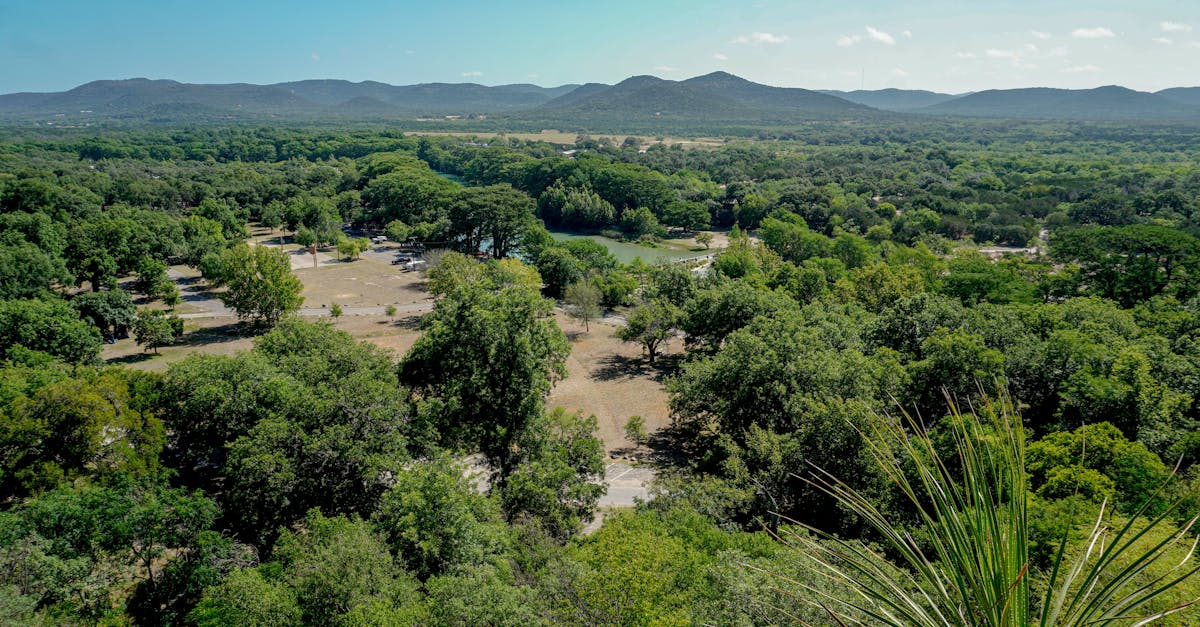 Aerial view of green Texas hill country valley with rolling hills