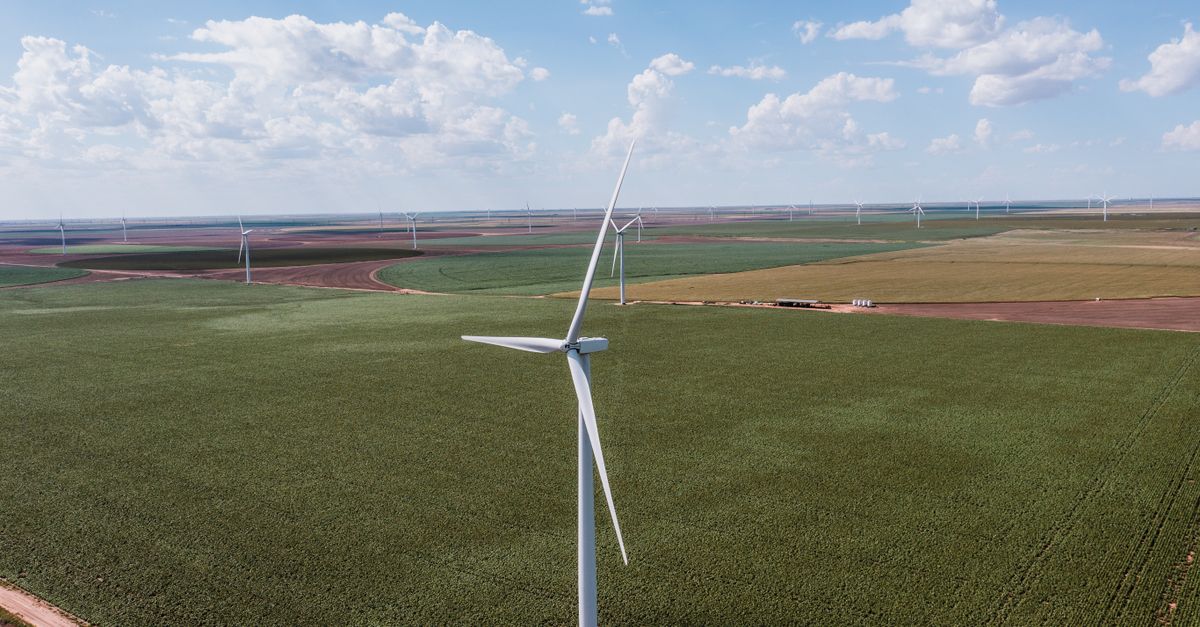 Aerial view of wind turbines over green agricultural fields in Groom, Texas, representing renewable energy on rural land.